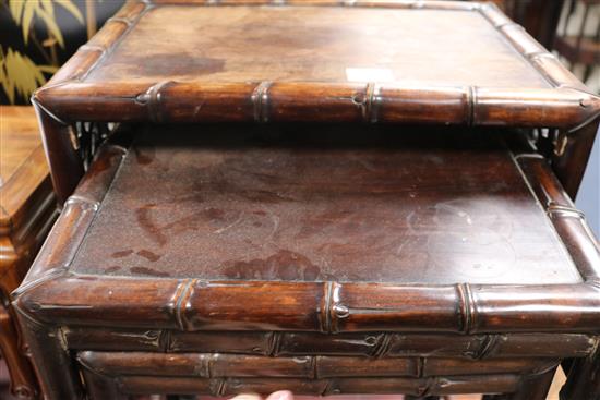 A nest of three Chinese hardwood tea tables W.48cm